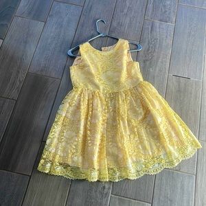 This dress is from Children's Place. Size 12. Bright yellow, with lace.